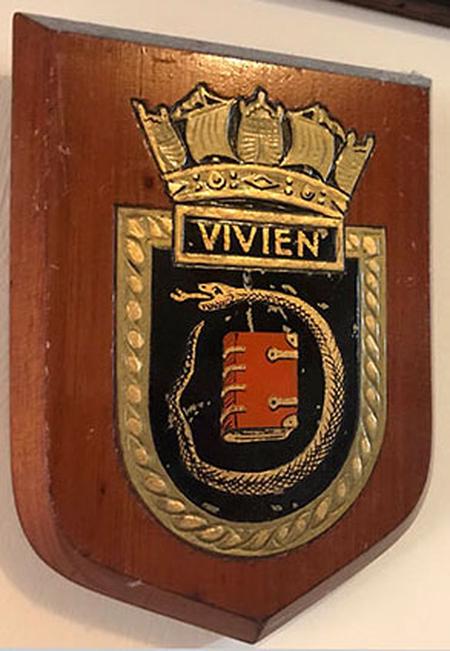 HMS Vivien's badge, showing the serpent surrounding the book, symbol of Vivien of Arthurian legend.  We would love to find out where the larger badge presented to Bromyard UDC in 1941 ended up.