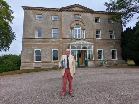 Major James Hereford outside his family home, Sufton Court.