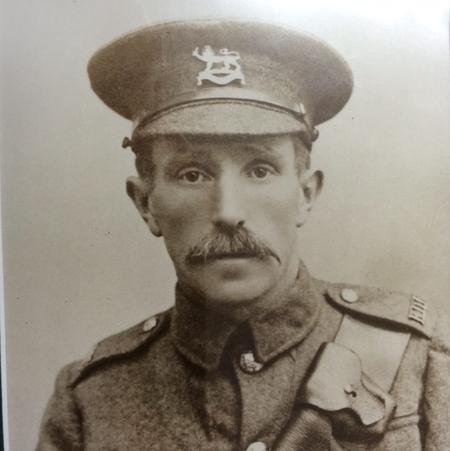 An unknown soldier of the Supplementary Company wearing the Herefordshire Regimental capbadge and wearing the shoulder title of the Royal Defence Corps (RDC)