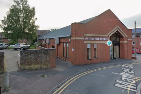 The old corrugated Church Room/Theatre was replaced by this new build in the 2000s. The Cattle Market has also closed and is now the site of the Hospital and care Home.