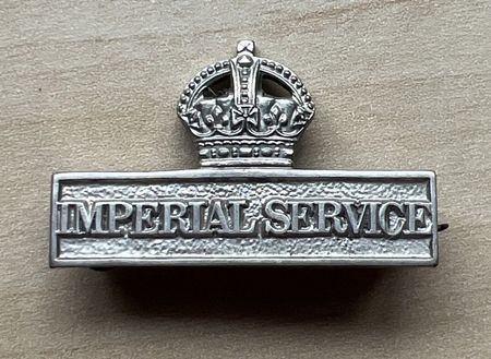 The Imperial Service Badge worn by Territorials who agreed to serve outside the United Kingdom.