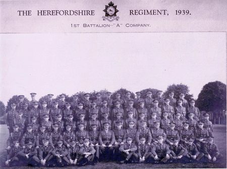 Alf Welch, seated on ground 6th from right.