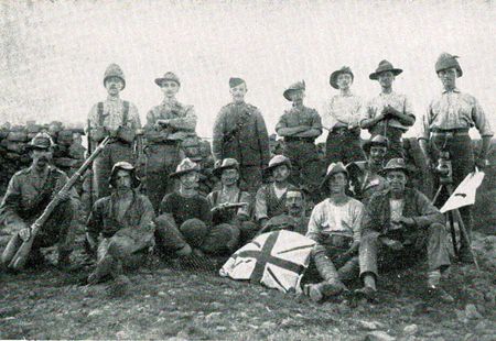 Men of the 1st VSC with Pte Cox, with Jacko on his lap, seated 2nd from left.