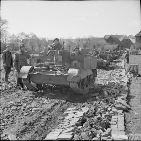 Later in the North-West Europe Campaign, carriers of the 1st Herefordshire's anti-tank platoon move up towards the Weser bridgehead, 7 April 1945. (IWM BU 3191)