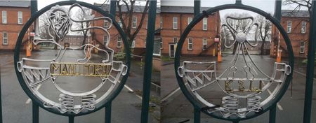 The view through the badges, between 2 what were originally barrack blocks, across the square to the ‘new’ accommodation block, latterly HQ 5 Division building. Before the square stands a memorial to the 48th Infantry Brigade - the gold cross of St Chad, on a green background.