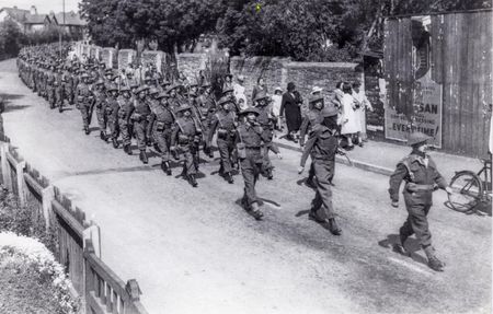 The HG marches past the Cemetery