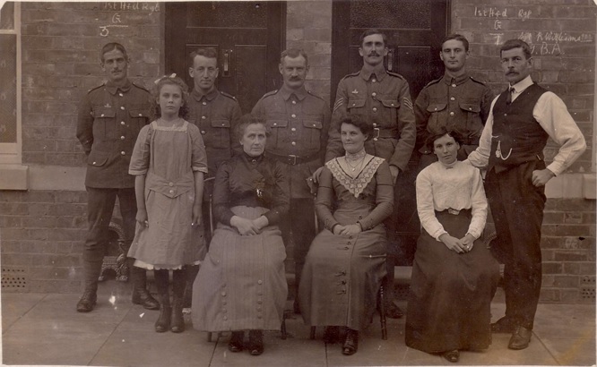Sgt Williams and men of G Coy 1st Battalion with their hosts.