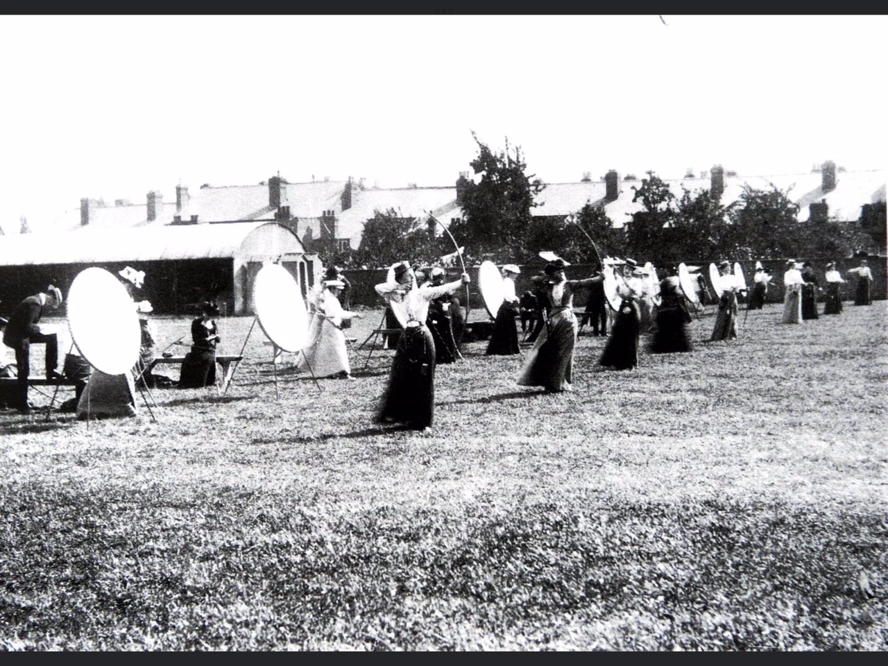 Ladies practising their archery at Suvla Barracks - note the sentry boxes against the shed.