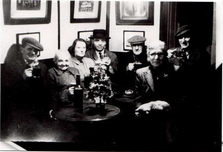 Grandad Taylor (centre in cap) enjoys a pint in the Brewery - Mrs James (landlady) to front.